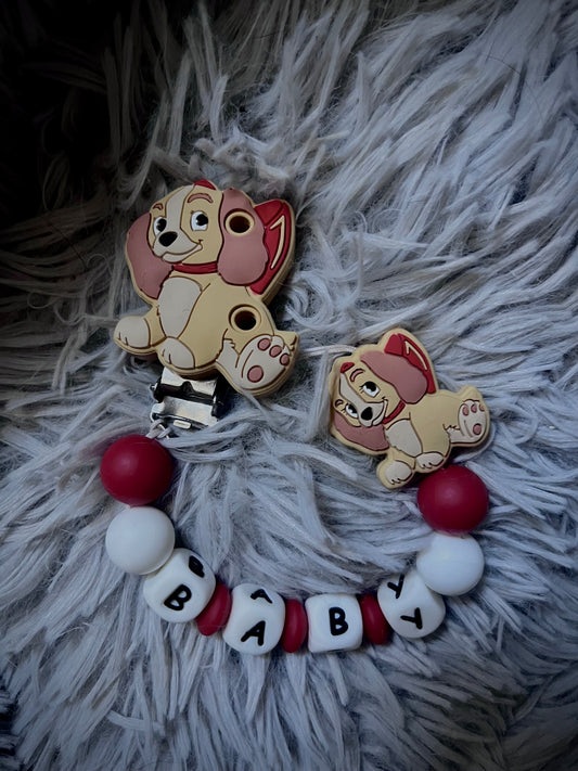 Attache tétine Chienne rouge